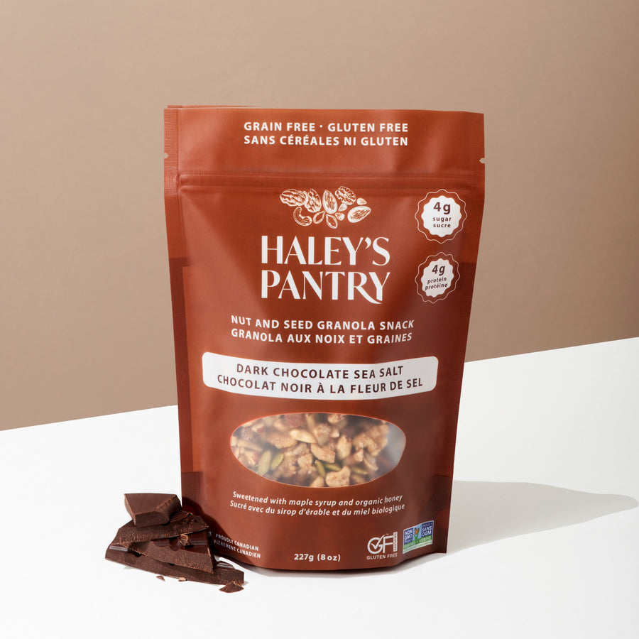 Haley's Pantry dark chocolate sea salt granola snack package on a beige background