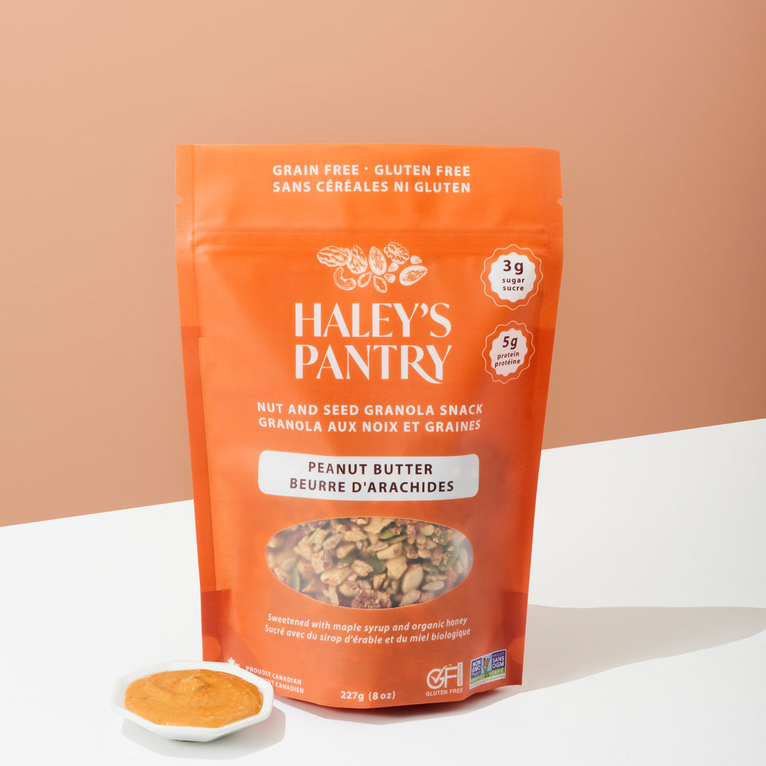 Orange package of Haleys Pantry peanut butter nut and seed granola snack on a beige background